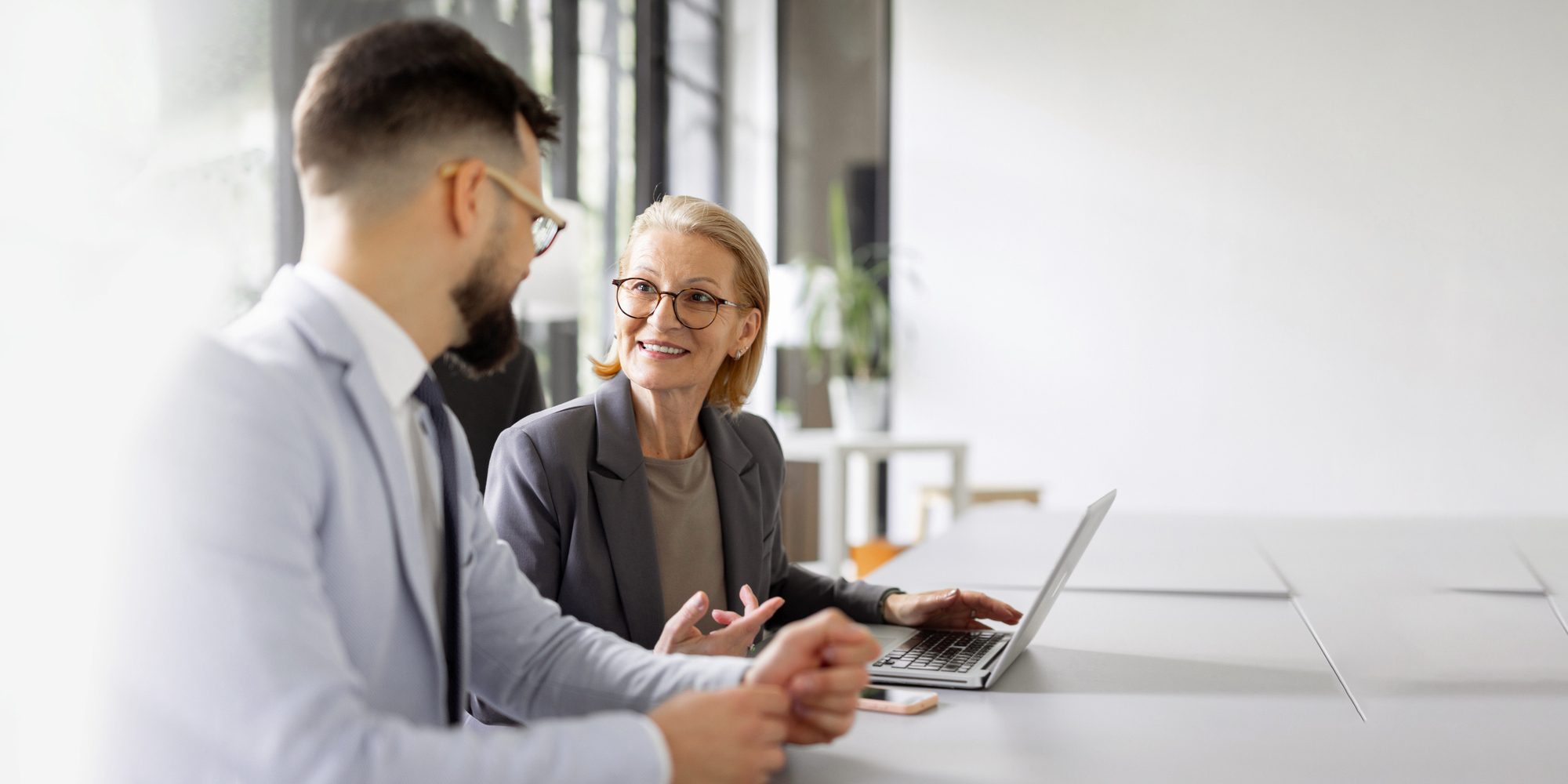 Woman on Computer with Man